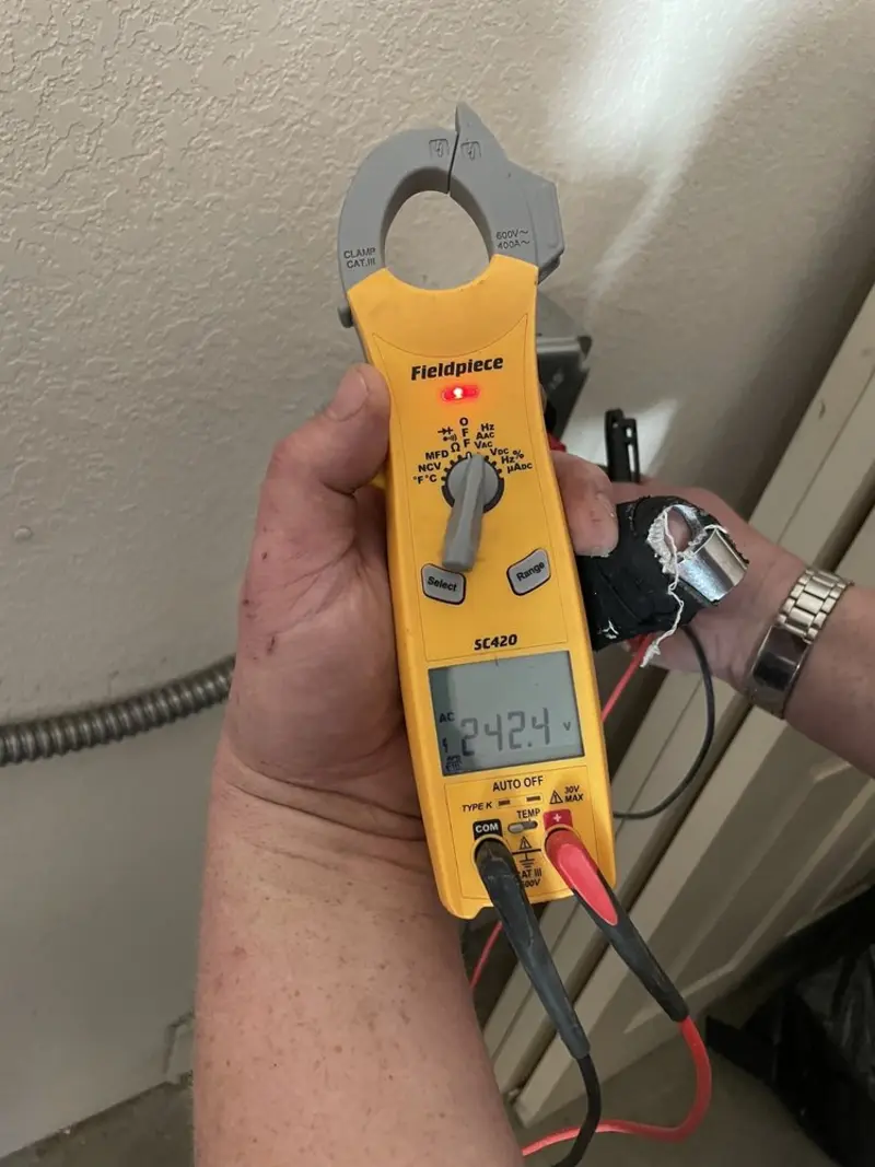 Voltage testing with clamp meter during Aluminum Wiring Replacement in Forest Oaks